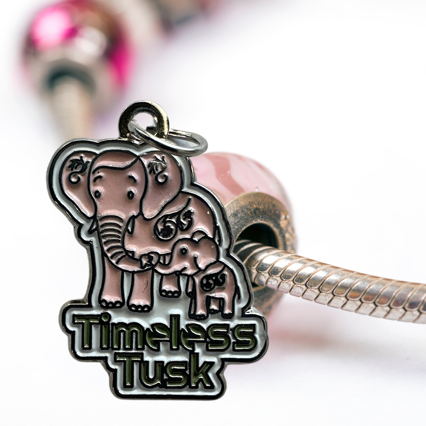 Elephant charm attached to a bracelet, symbolizing strength and wisdom