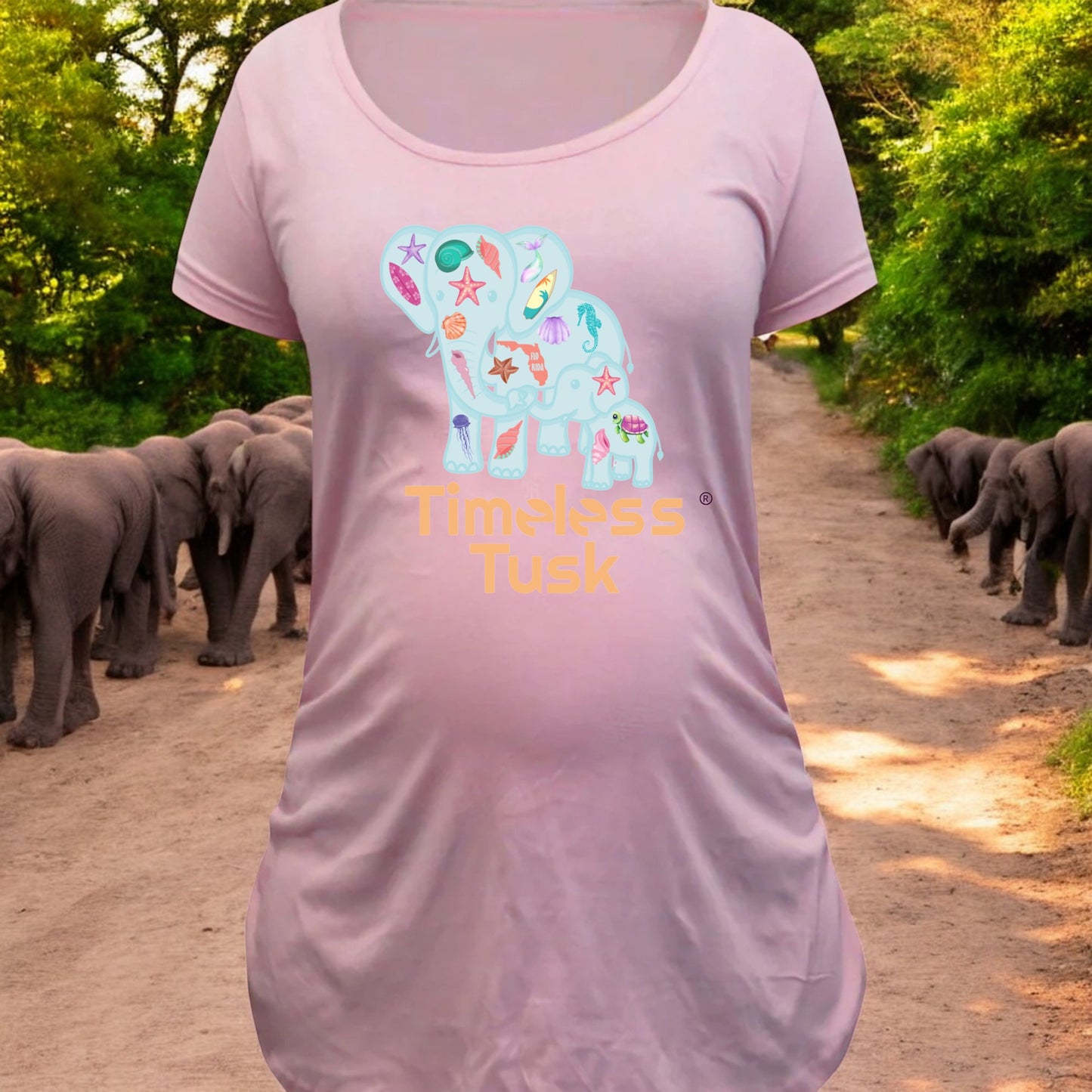 Close-up of the seashell and elephant graphic, printed on soft, eco-friendly fabric.