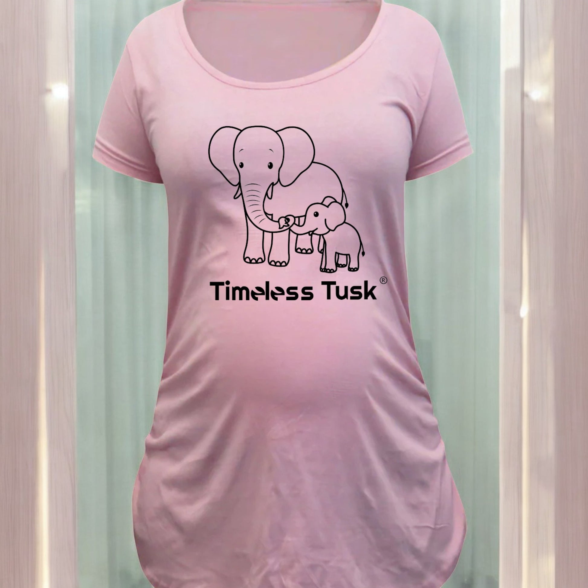 pink maternity t shirt with black line drawing of mom and baby elephant